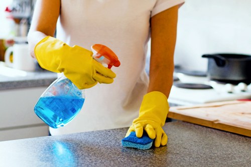 Technician managing workplace safety during carpet cleaning